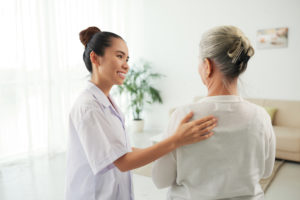 Nurse speaking with older patient about care options | cCARE | Fresno, CA