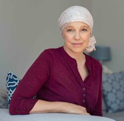 Cancer Overview | cCARE, San Diego & Fresno | Woman living with cancer | cCARE | San Diego and Fresno, CA | Woman in headscarf living with cancer