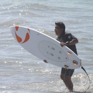 Chris with surfboard